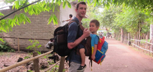 Carrying son in front and backpack in back on Gili Air, Indonesia