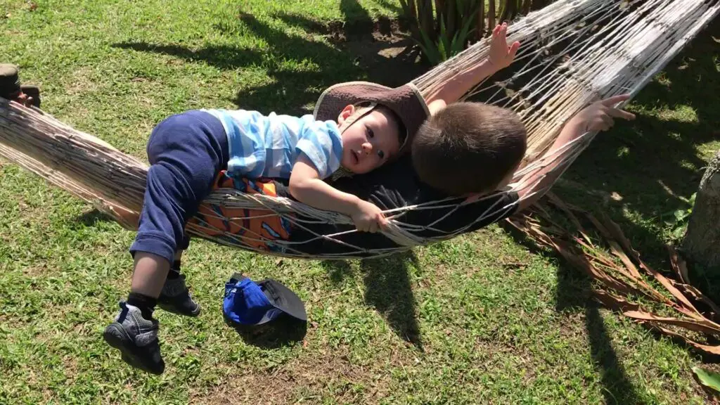 boys relaxing in hammock
