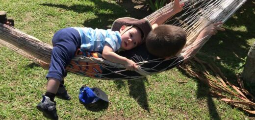 boys relaxing in hammock