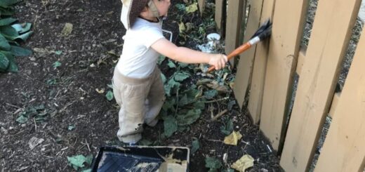 baby painting fence