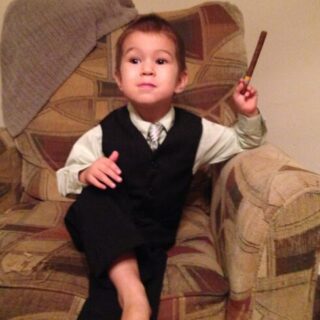 little boy in suit with cigar