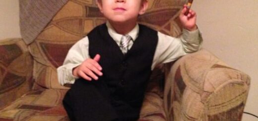 little boy in suit with cigar