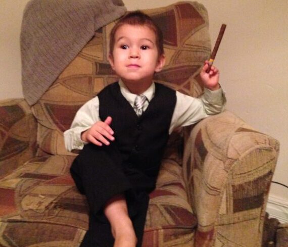 little boy in suit with cigar