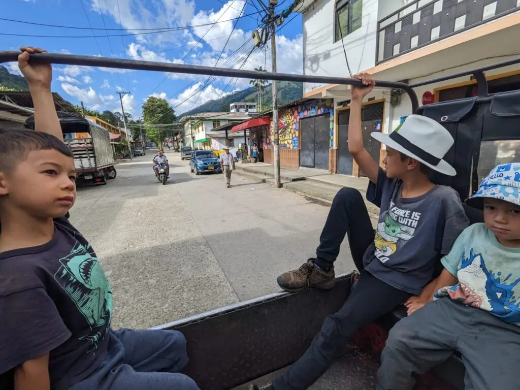 Kids in the back of a jeep in small Colombian town.